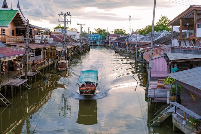 Amphawa Floating Market & Maeklong Railway Train Market Tour - Wat Bang Kung beneath banyan roots