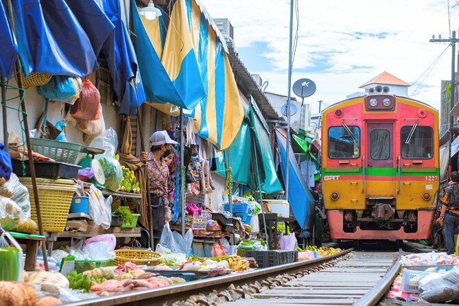 Amphawa Floating Market & Maeklong Railway Train Market Tour - Maeklong Railway Market and the train that cuts through it