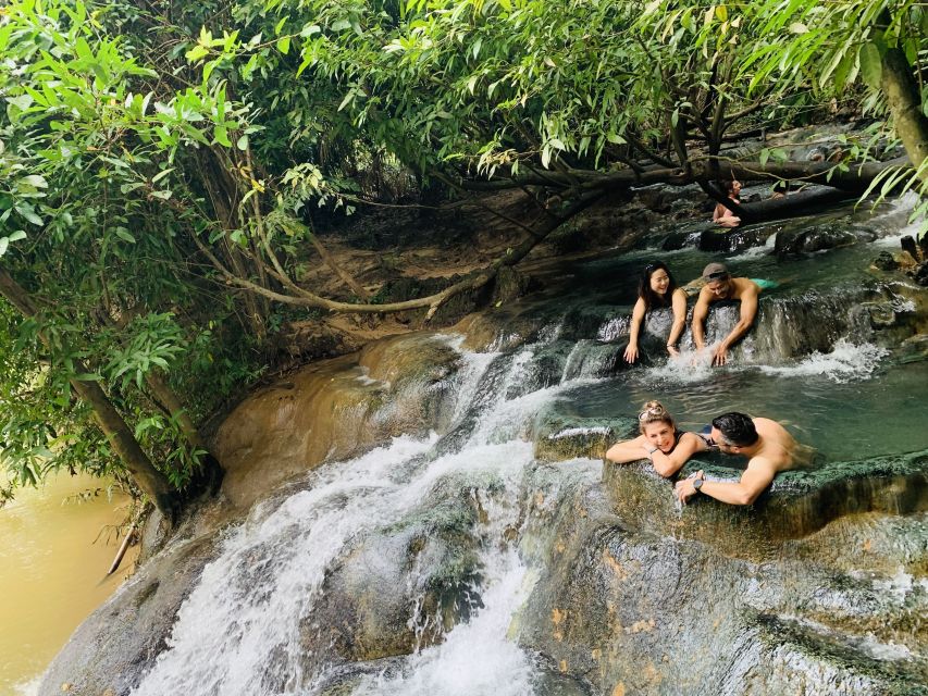 Ao Nang: Hot Spring, Emerald Pool & Tiger Cave Temple Tour - Soaking at the hot spring waterfall