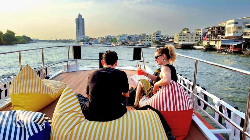 Bangkok : Chaophraya Booze Cruise – Drinks Onboard - Wat Arun glowing beside the dark water