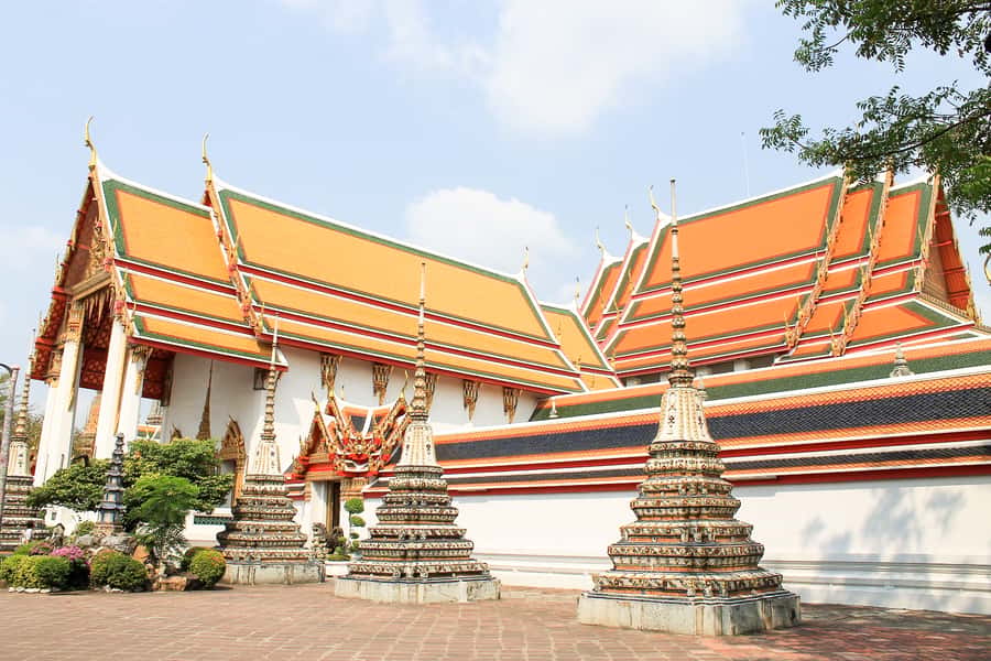 Bangkok: City Highlights Temple and Market Walking Tour - Wat Arun beside the Chao Phraya River