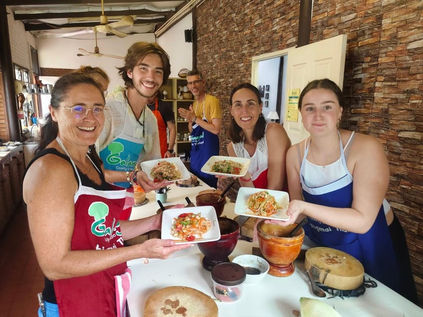 Chiang Mai: Morning Cooking Class with Market Visit - Picking herbs in an organic garden