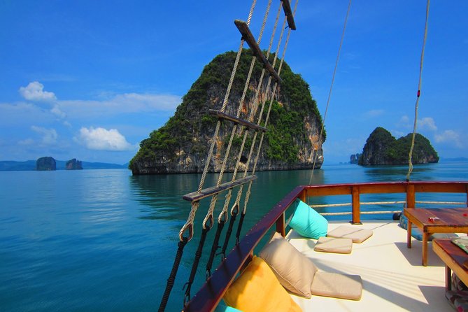 Cruising on a comfortabel boat in Phang Nga Bay - The "Must-Do" Tour Khao Lak - Cruising past cliffs, caves, and bird-nest rock faces