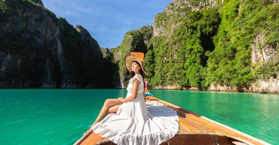 From Phi Phi: Half-Day Longtail Boat Tour with Snorkeling - A busy island tour with an old-style boat feel