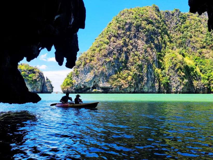 Koh Lanta: Sea Cave Kayaking and Talabeng Island Tour - Boarding a traditional longtail boat to Ung Island