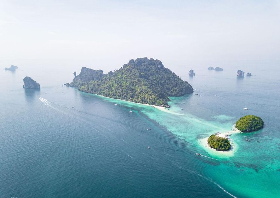 Krabi: 4 Islands & Krabi's Separated Sea Longtail Boat Tour - Taking a traditional longtail boat across the Gulf