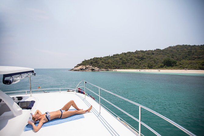 Pattaya Full-Day 3 Tropical Island tour Snorkeling Cruise Buffet - Leaving Pattaya behind on a 54-person catamaran