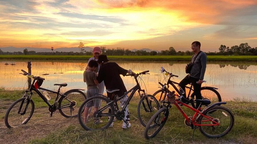 Sukhothai: 2.5-Hours Guided Countryside Sunset Bike Tour - Sunset beneath the Khao Luang mountains